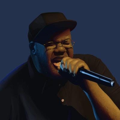 A digital painting of the rapper Gift of Gab; he is holding a microphone to his mouth in mid-rap, wearing a black polo shirt and black baseball cap, is lit by a warm yellow light from the right, and cool cyan light from the left.